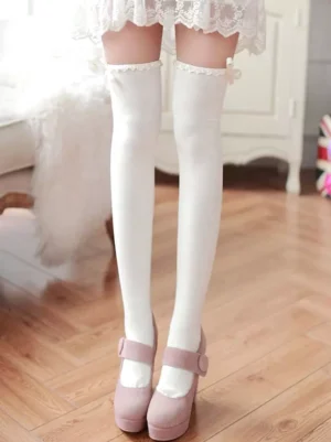 White over-the-knee Lolita socks with ruffled lace cuff trim front leg view showing elegant decorative details and classic lolita aesthetic