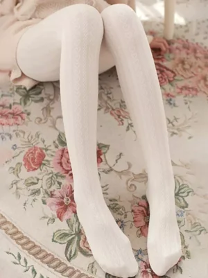 white-lolita-tights-front-seated-view-pure-white-woven-knit-texture-indoor-floral-rug-background