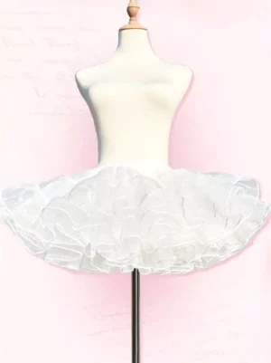 White sheer ruffled lolita petticoat flat lay view on pink indoor background, displaying neat tiered layers and minimalist design of 30cm unboned underskirt