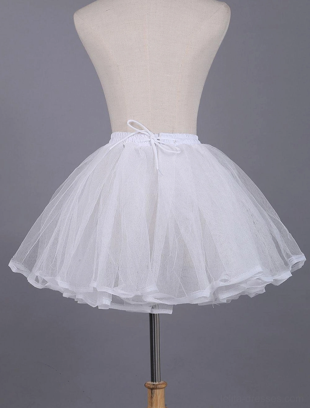 White tulle petticoat with drawstring waist closure layered design and satin hem edge showcasing adjustable fit for lolita fashion