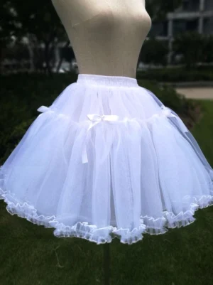 White lolita petticoat with elastic waistband satin bows fluffy tulle silhouette mesh trim outdoor garden setting