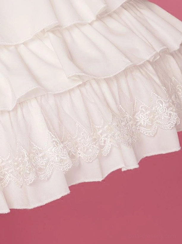 Close-up hem detail of white Lolita petticoat showing embroidered lace trim and layered ruffled fabric with soft chiffon texture