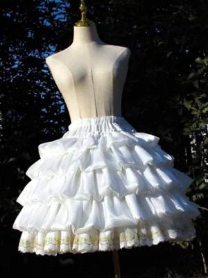 White ruffled lolita petticoat front three-quarter angle displaying gold embroidered lace hem and glossy polyester fabric