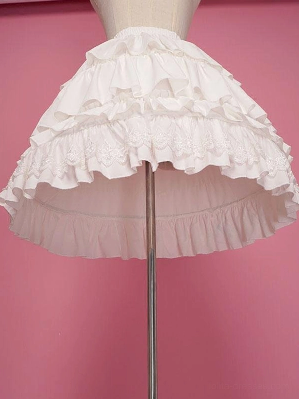 White Lolita petticoat side low angle view displaying multi-layered ruffle construction and sheer mesh fabric with embroidered lace hem trim