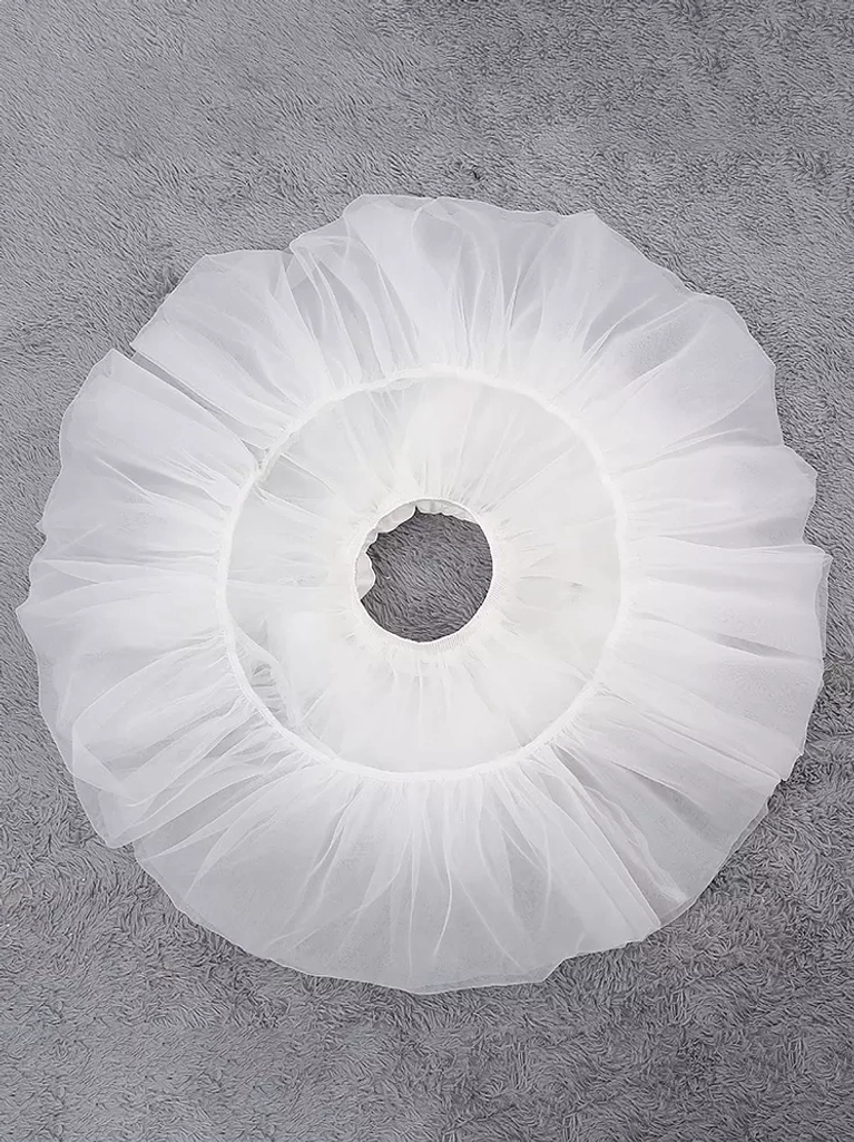 Top-down overhead view of white lolita petticoat showing circular silhouette layered sheer gauze construction and hollow waist