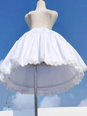 White lolita petticoat underskirt front three-quarter view showcasing flared gathered silhouette with delicate scalloped lace hem trim displayed on dress form against blue sky outdoor backdrop