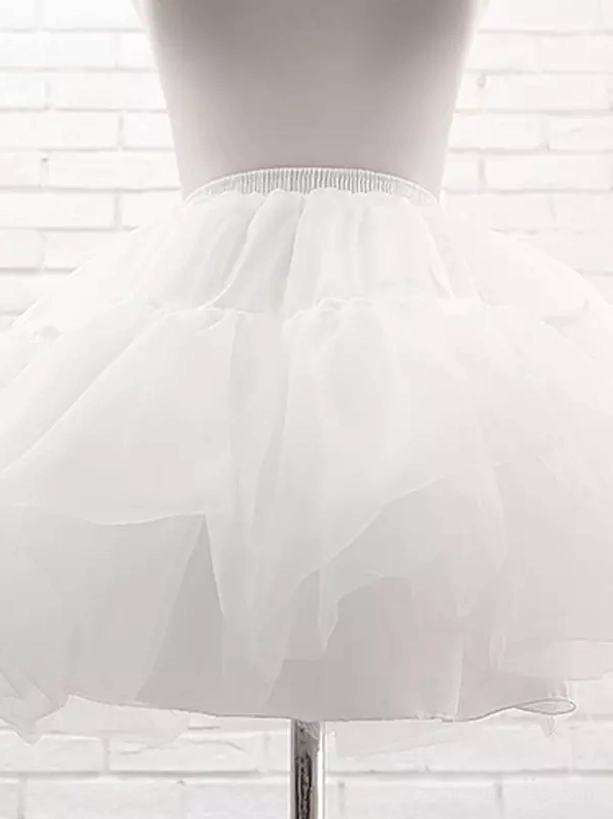 White lolita petticoat waist-down close-up showing elastic waist soft flared ruffled skirt and tulle volume detail