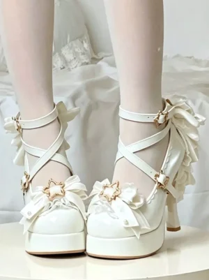 White lolita platform high heels featuring crisscross ankle straps, large decorative back bow, gold star hardware, and pearl-adorned front lace bows