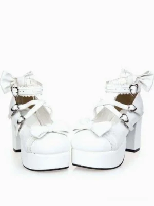 White lolita chunky platform shoes direct front view featuring dual heart buckles on cross straps and small ankle bow decorations, romantic aesthetic design