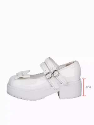 Single white lolita wedge pump with bow decoration and dual buckle strap side three-quarter angle
