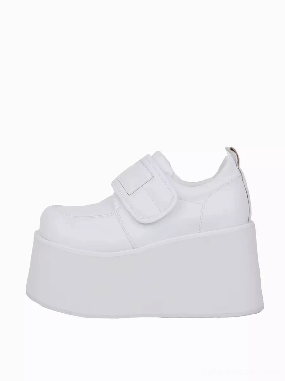 Single white lolita platform pump front three-quarter side view thick wedge platform sole hook-and-loop ankle strap secure fastening system
