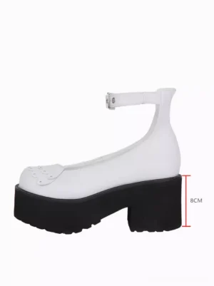 Single white Sweet Lolita platform pump right side three-quarter angle showing 8cm block heel, scalloped toe decoration, silver ankle buckle strap detail