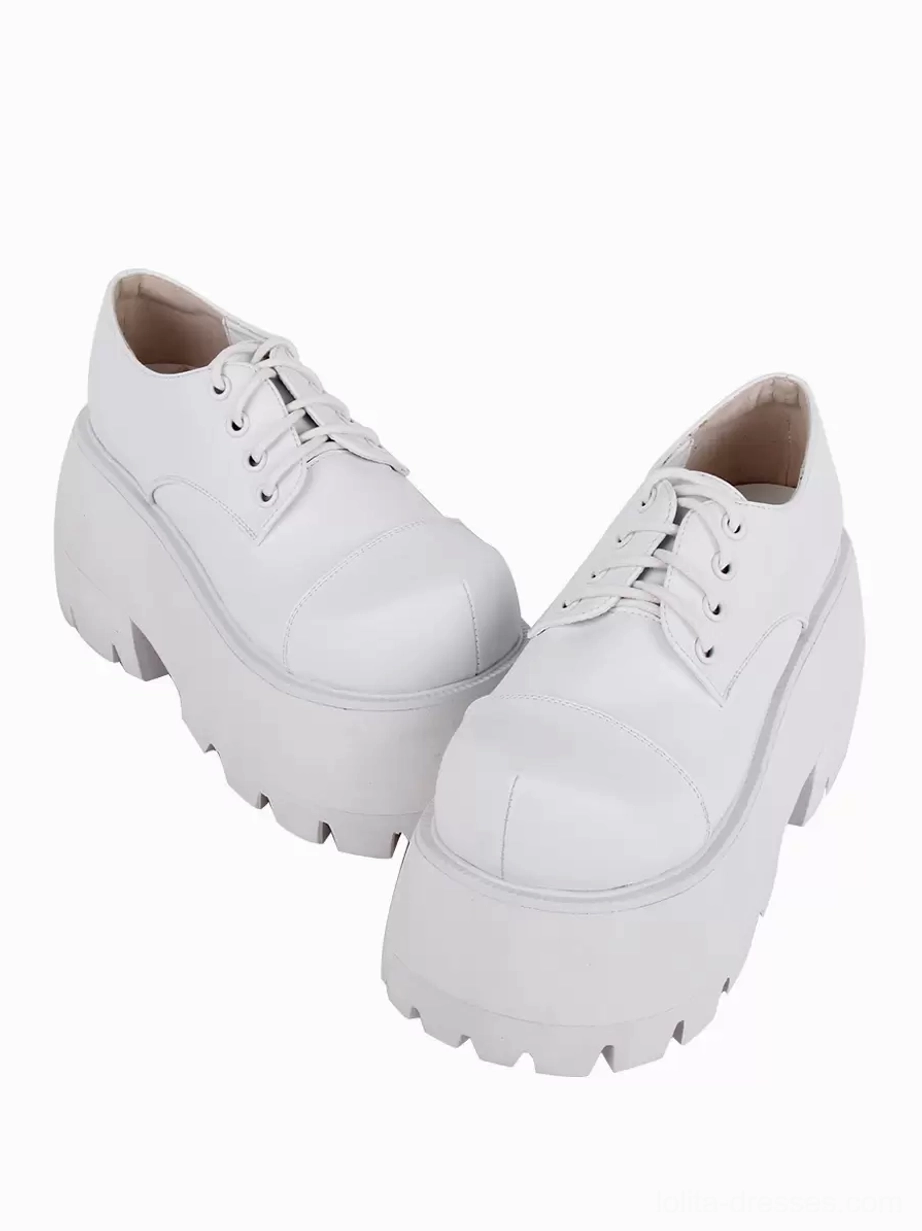 white lolita platform pumps rear front paired view oblique angle thick lug sole heel structure visible