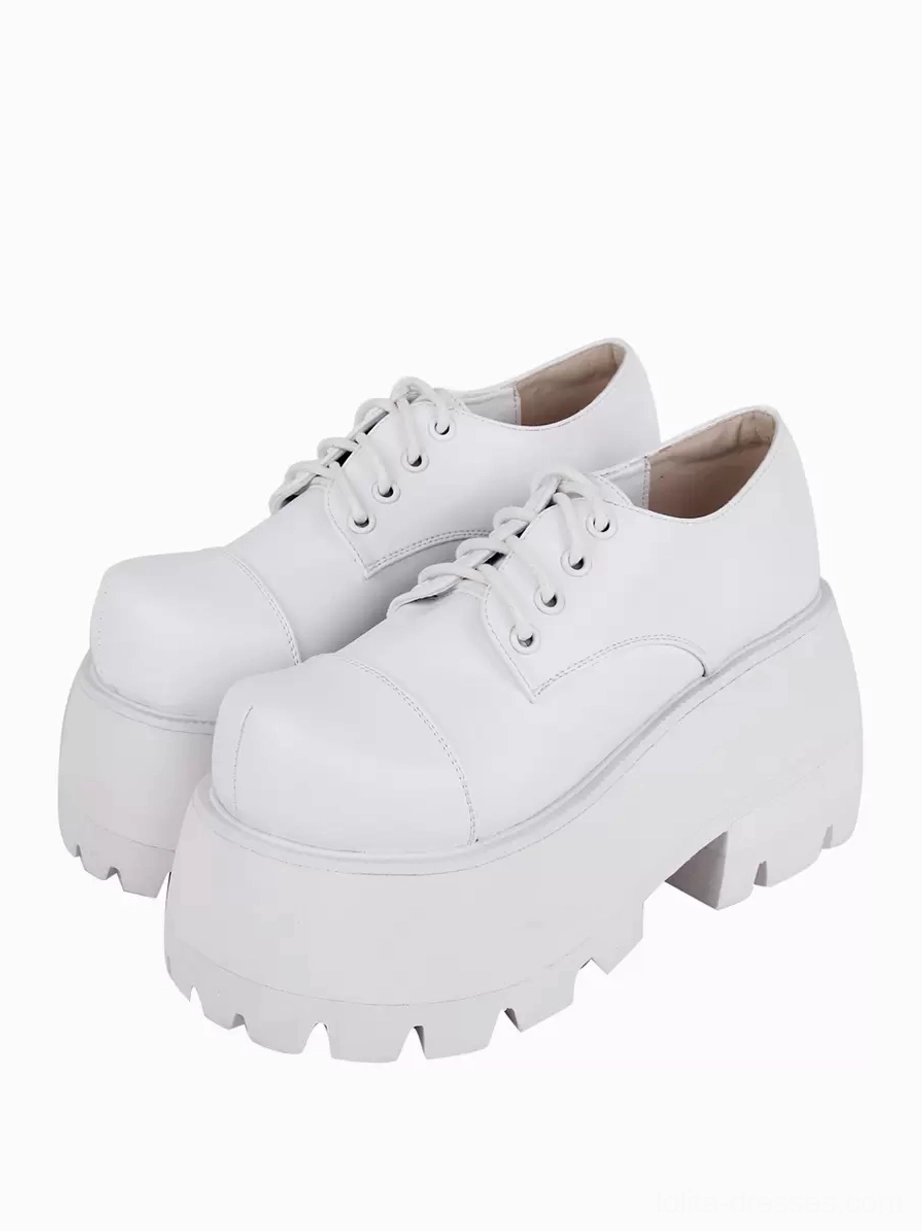 white lolita platform pumps paired oblique front view round toe serrated lug sole gothic footwear