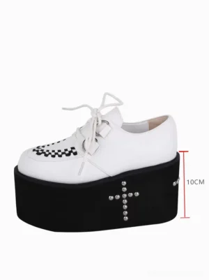 Side profile of white lolita platform shoe displaying 10cm thick black sole with silver cross rivet decorations and height measurement