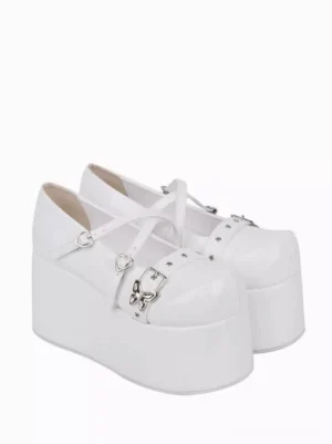 white lolita platform shoes lateral side view showcasing glossy pu leather finish and heart-shaped metal accents from angle