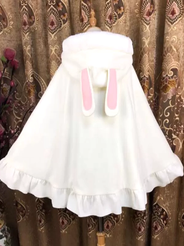 White Lolita poncho coat back view featuring bunny ears with contrasting pink inner details, ruffled hem, and clean white fabric design