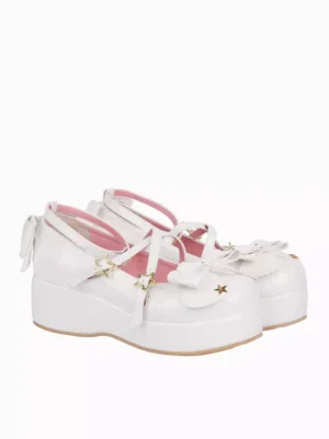 White lolita platform pumps side three-quarter view cross straps back bow detail patent leather glossy finish