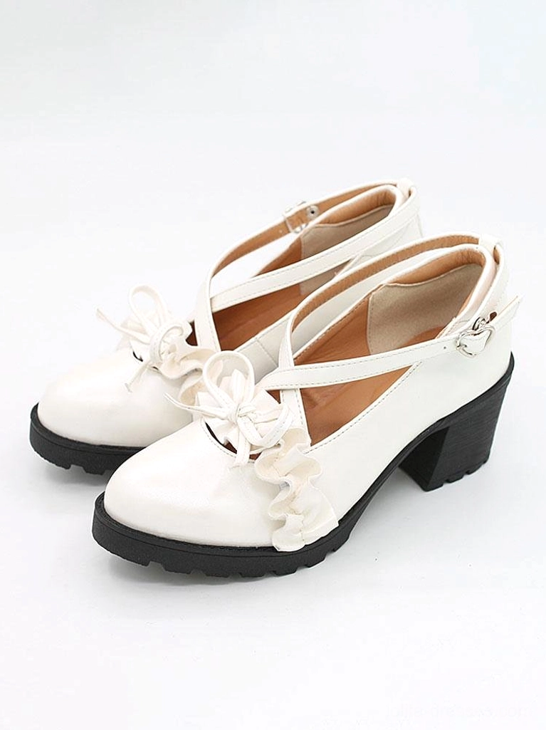 White Lolita pumps front flat lay view on plain white background, cross strap ruffle bow detail and chunky block heel design featured prominently