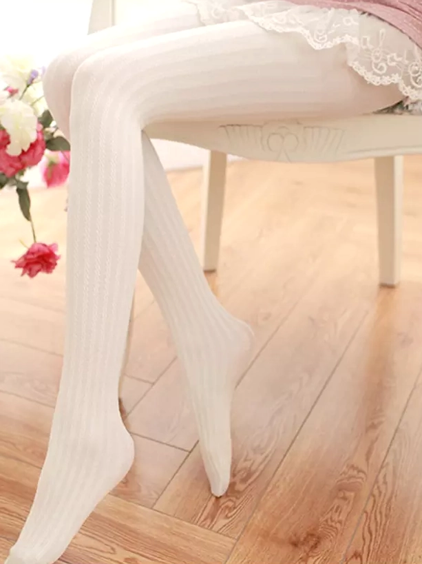 White opaque Lolita socks tights seated position showing ribbed pattern texture with lace trim coordination