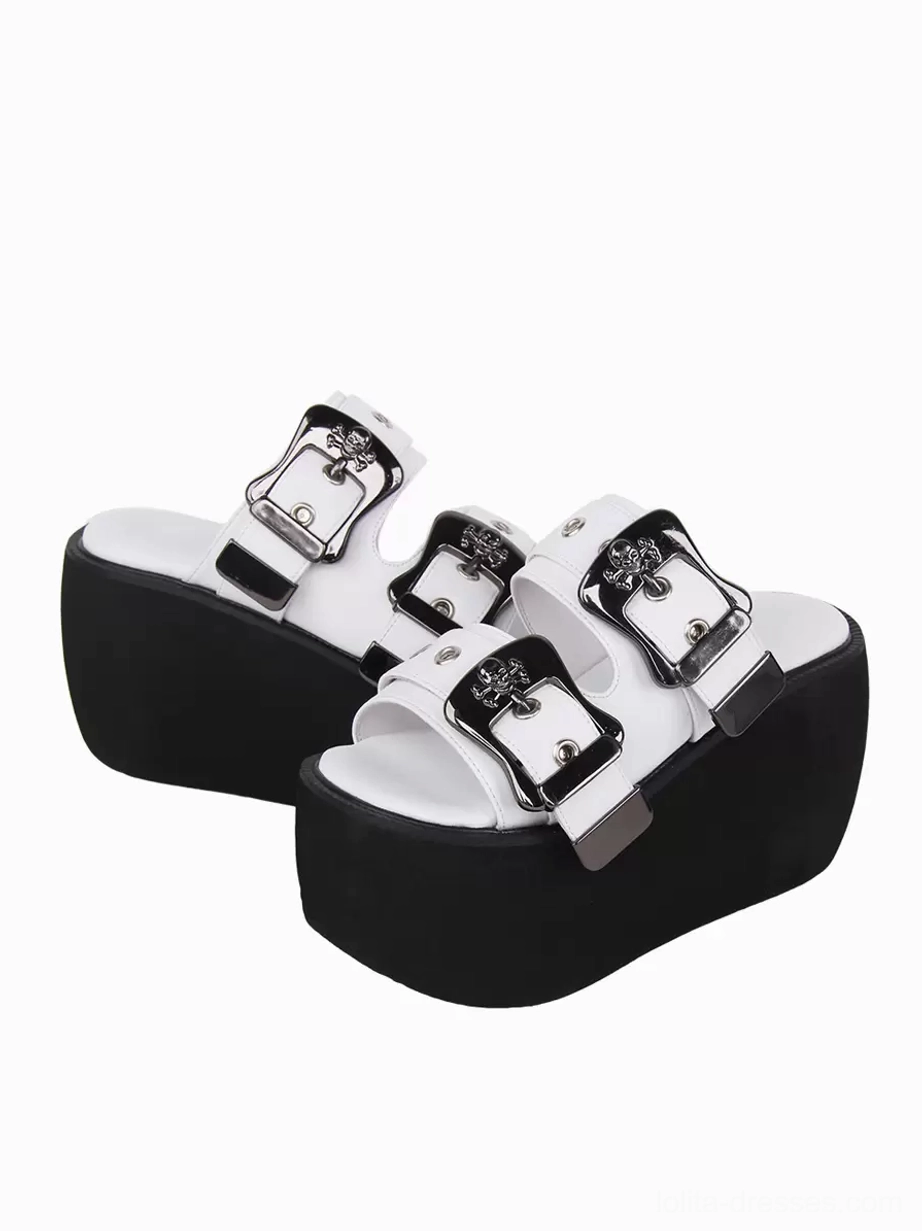 Paired white lolita wedge sandals low front three-quarter view dual adjustable buckle straps silver gothic hardware black thick platform base