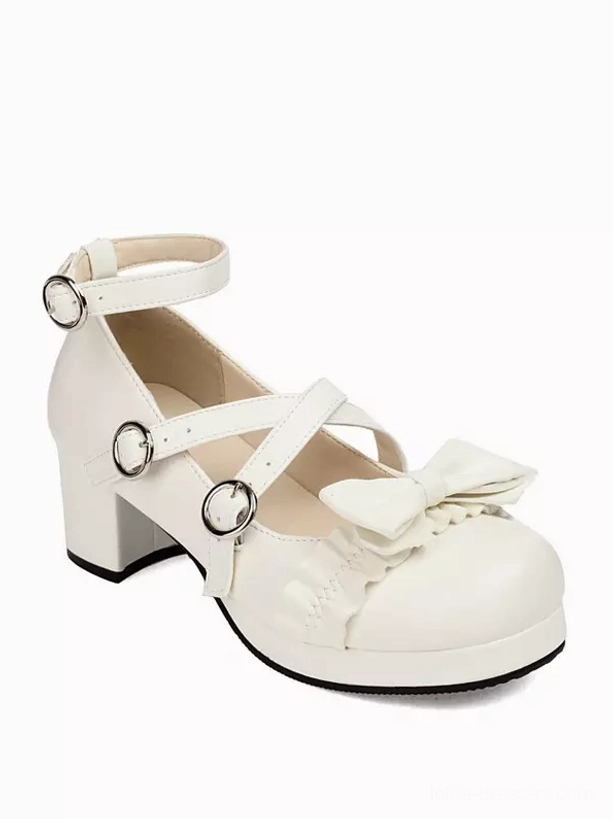 White matte Sweet Lolita block heel pumps side three-quarter view, displaying cross ankle straps with metal buckles, front bow decoration, and sturdy chunky platform heel