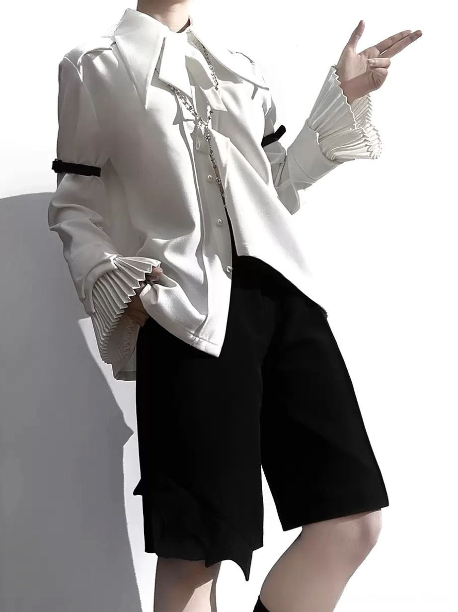 White Gothic Ouji Lolita blouse set with pleated ruffled cuffs black arm bands asymmetrical hem shorts side-front angle model