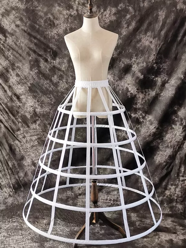 White lolita petticoat side angle showing slim metal hoops and flared silhouette with elegant proportions