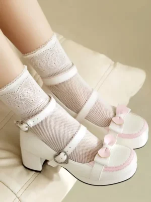 White and pink sweet lolita block heel pumps with heart-shaped buckles and pink bow accent worn with lace mesh socks side profile
