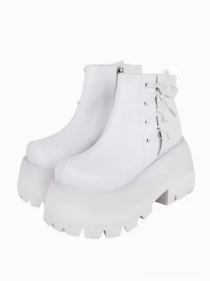 white platform lolita ankle boots with lace-up bow detail front three-quarter view pure white background serrated thick sole