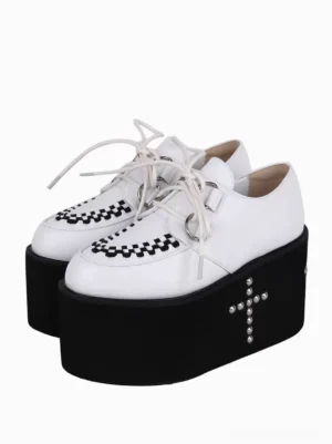 White platform lolita shoes with checkered toe cap and silver cross rivets front three-quarter view showing lace-up design