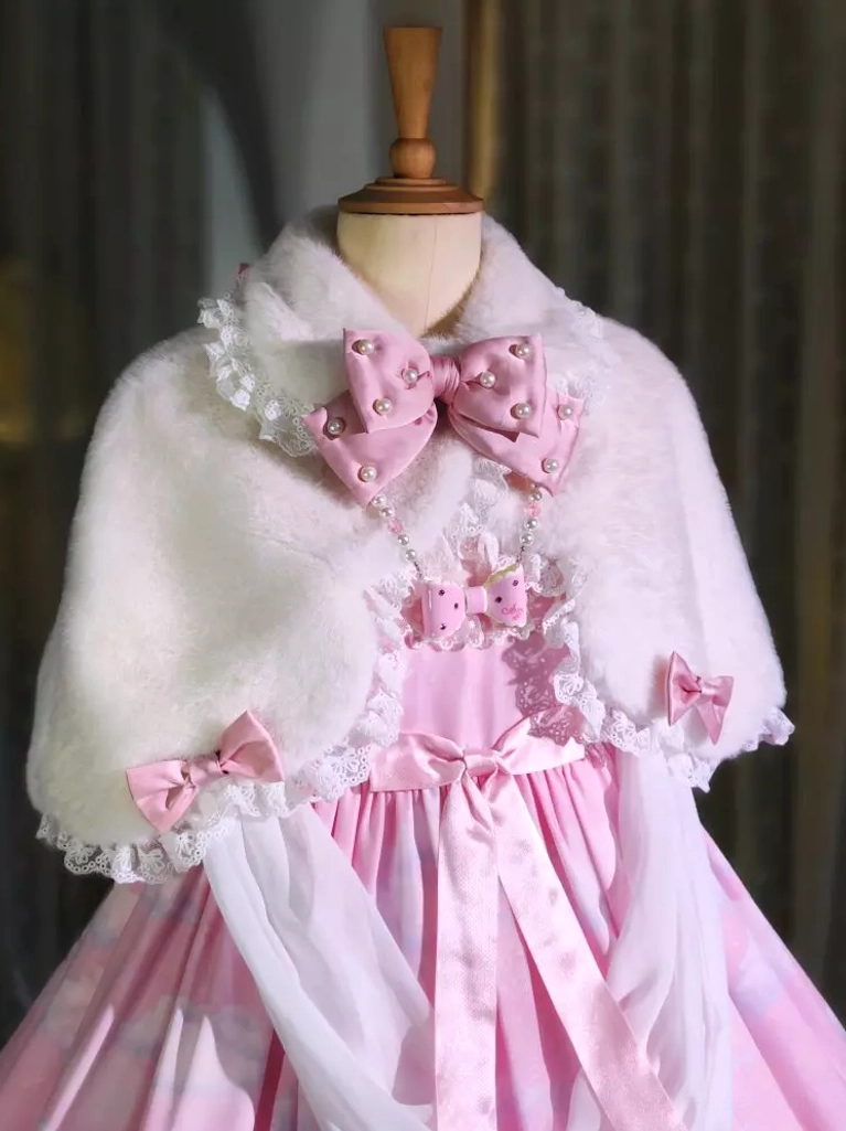 White fuzzy plush lolita bunny ear cape with pearl-studded pink bow and lace collar trim worn with pink lolita dress front view