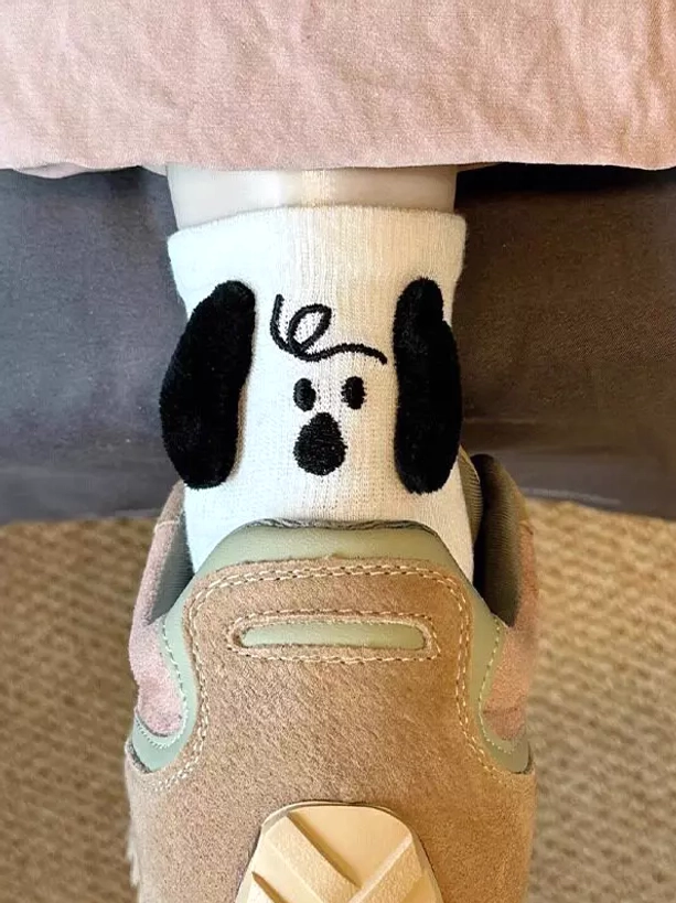 White 3D puppy plush lolita socks with flocked black ears styled with retro tan sneakers, kawaii hosiery outfit coordination