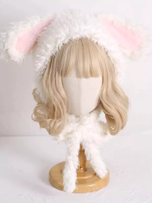 Side view of white plush rabbit ear hat with curled long white scarf straps on mannequin
