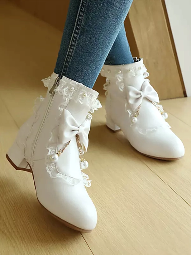Side profile of white rococo lolita boots featuring side zipper fastening, round toe construction, comfortable low block heel and ruffle lace trim embellishments