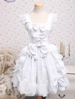 White rococo lolita jsk dress with square neckline ruffled shoulder straps front bows and layered tiered ruffled skirt full front view on dress form