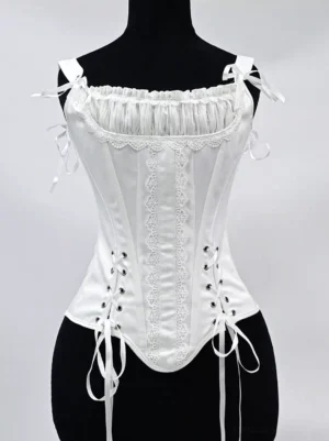 White satin lace-up corset bustier front view with ruched sweetheart neckline, lace trim detail, and adjustable tie spaghetti straps on dress form mannequin