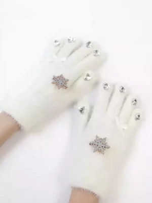 White plush Lolita gloves with snowflake rhinestone brooch and fingertip embellishments, flat lay top-down view on pure white background