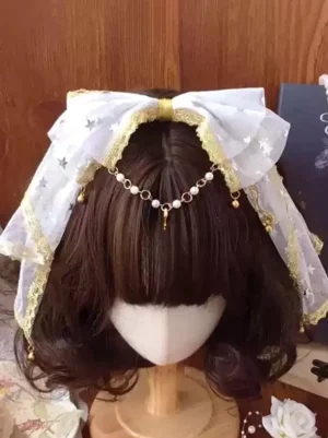 White star mesh lolita bow headdress with gold lace trim and pearl drop chain forehead ornament, front overhead view on mannequin
