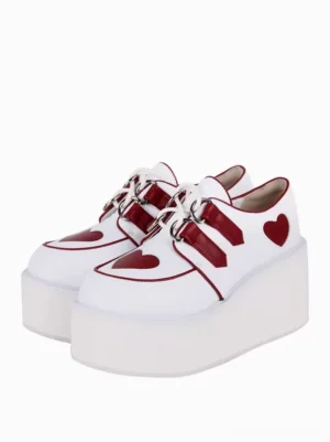 White steampunk lolita platform shoes with red heart motifs and lace-up straps front paired display view showing wedge heel construction