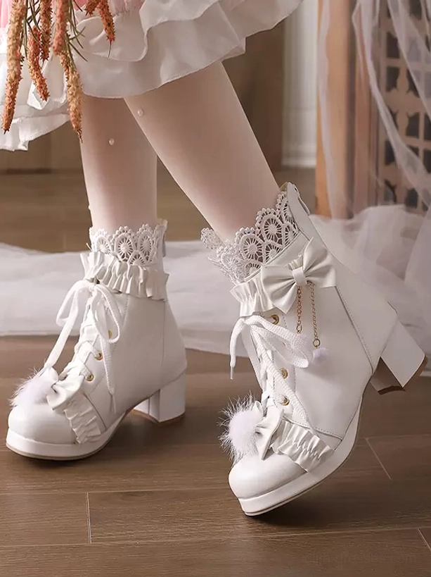 White sweet lolita ankle boots with oversized bow front view worn styling with ruffled lace socks and lolita skirt round toe block heel