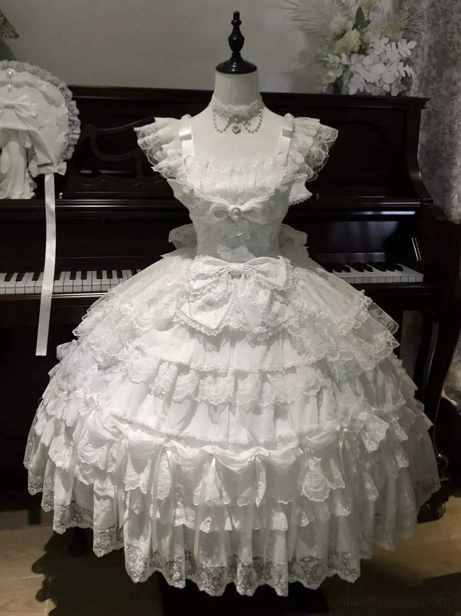 White off-shoulder sweet lolita ball gown on dress form displaying ruffled cap sleeves and layered lace skirt