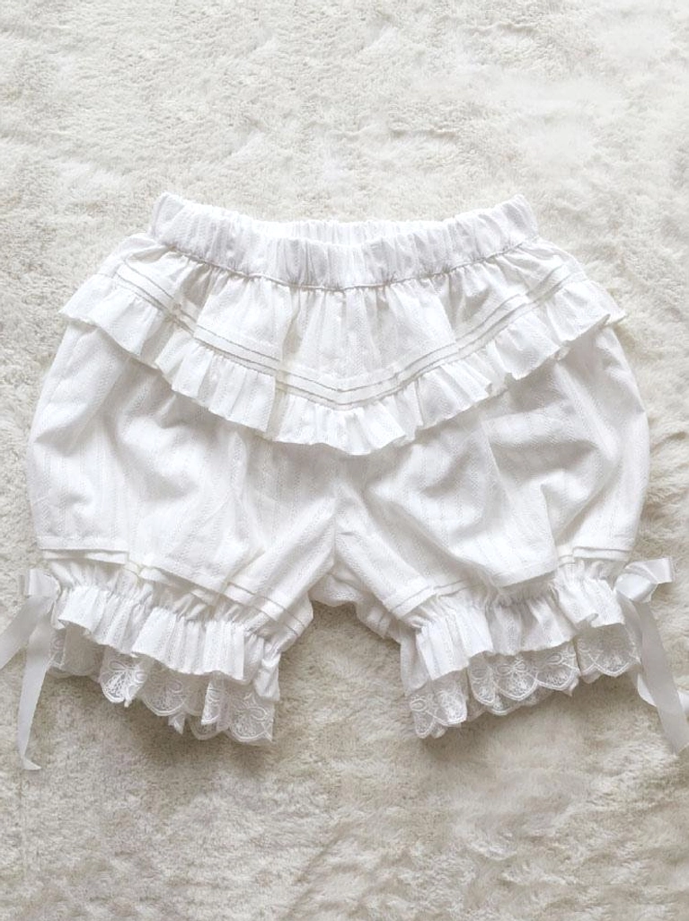 White sweet lolita bloomers with jacquard striped pattern flat lay showing double ruffled waist and satin bow details
