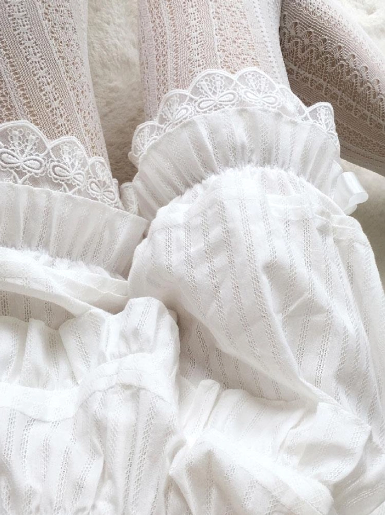 White jacquard striped bloomers paired with lace stockings showing leg opening ruffles and complete styling