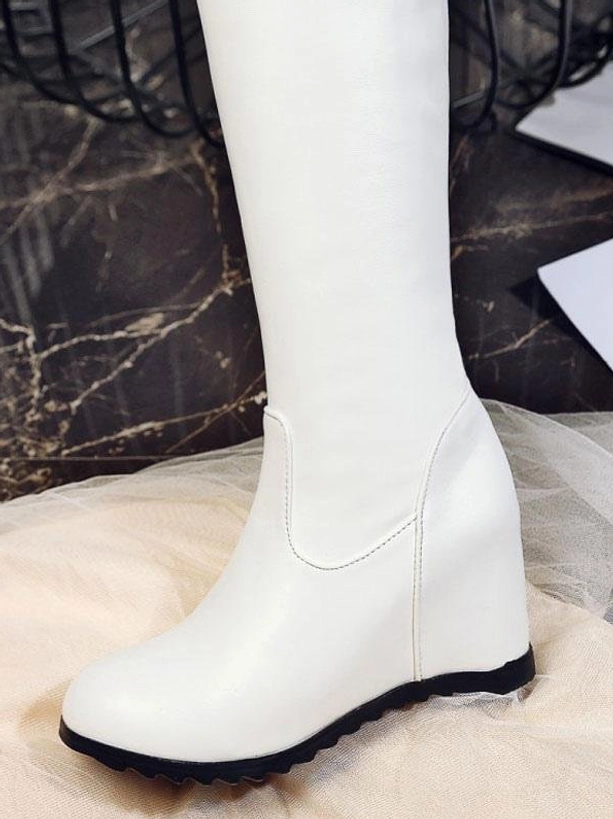 White over-the-knee sweet lolita boot close-up front view round toe black wedge outsole marble background