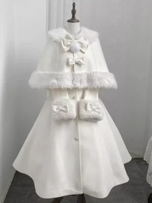 White sweet lolita bow cape coat with faux fur trim front flat lay view on dress form showing embellished collar and pom-pom bow details