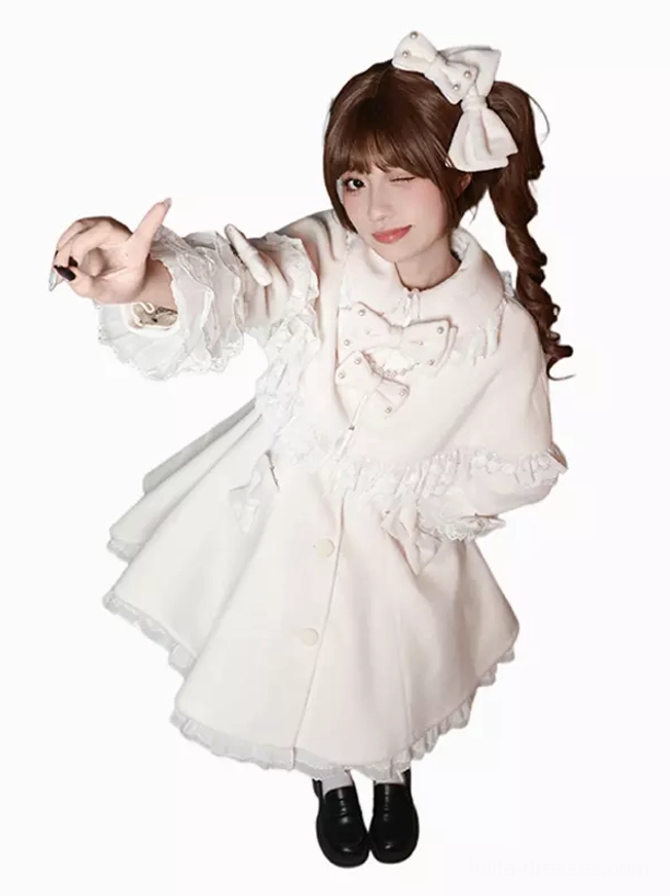 White sweet lolita ruffled coat studio half body front shot with chest bow ruffled cuffs and sheer lace hemline