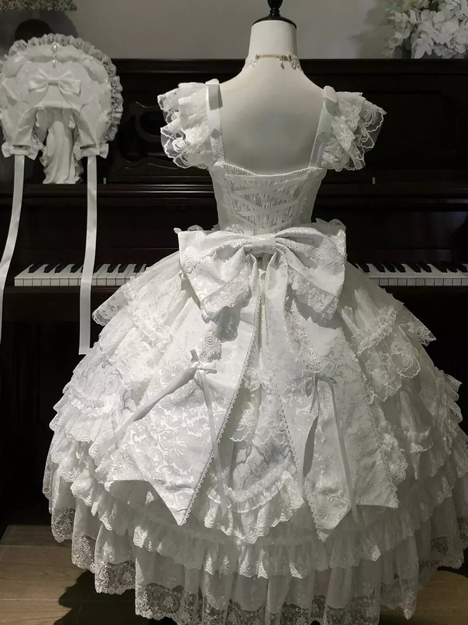 White sweet lolita ball gown back view on dress form with embroidered lace trim and statement back bow detail
