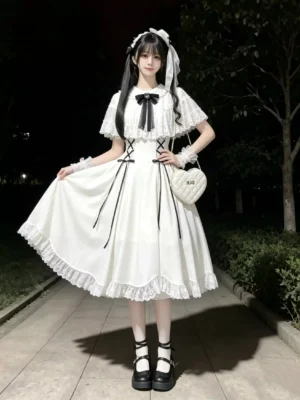 Short sleeve white lolita dress with lace hem and black ribbon accents night outdoor photography