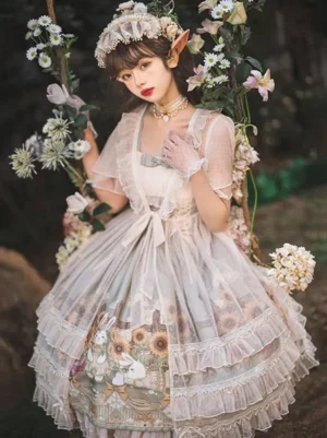 White Sweet Lolita dress with tiered ruffles and printed skirt body worn outdoors in a flower garden setting, full front view showcasing the complete silhouette and bow waist accents